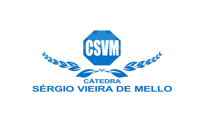 banner_notícia_cátedra
#ParaTodosVerem:
Imagem com fundo claro e elementos gráficos em tons de azul. Ao centro, há um símbolo em formato octogonal com a sigla “CSVM”. Abaixo, aparece a palavra “Cátedra” e, em destaque, o nome “Sérgio Vieira de Mello”. O símbolo é acompanhado por ramos estilizados nas laterais, formando uma composição simétrica. Trata-se da identidade visual da Cátedra Sérgio Vieira de Mello.